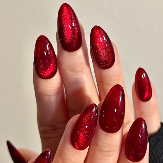 Rich burgundy cat-eye press on nails.
Stunning shiny red shimmer that catches every light.