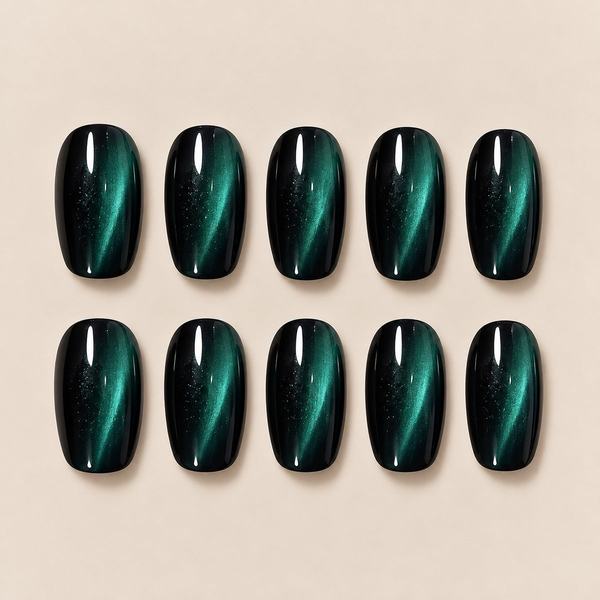 Elevate your look with these mesmerizing dark green cat eye almond press-on nails. The striking cat-eye effect shifts beautifully with light, creating a deep, mysterious emerald glow. Perfect for date nights, evening outings and special occasions.